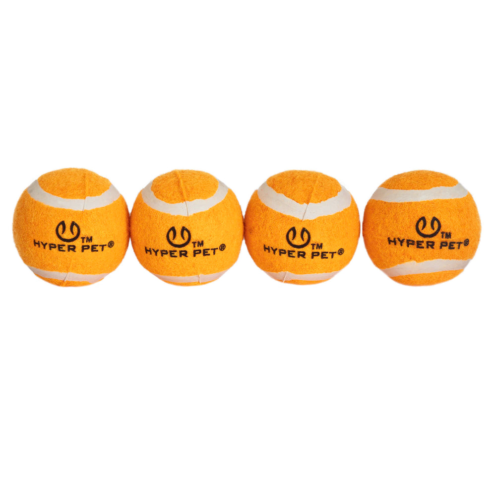 Four Hyper Pet Blaze Orange Tennis Balls are lined up in a row on a white background, each displaying the HYPER PET logo in black, ensuring compatibility with K9 Kannon and pet safety.
