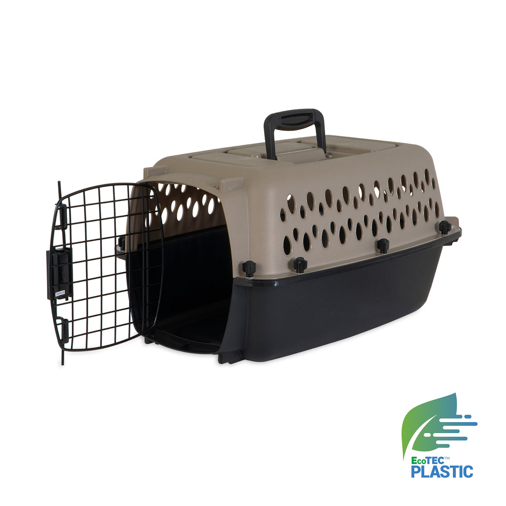 The Petmate All Purpose Kennel - Vari is a beige and black plastic pet carrier with a top handle, ventilation holes, an open metal door, and EcoTEC logo. This Petmate kennel meets air travel requirements.