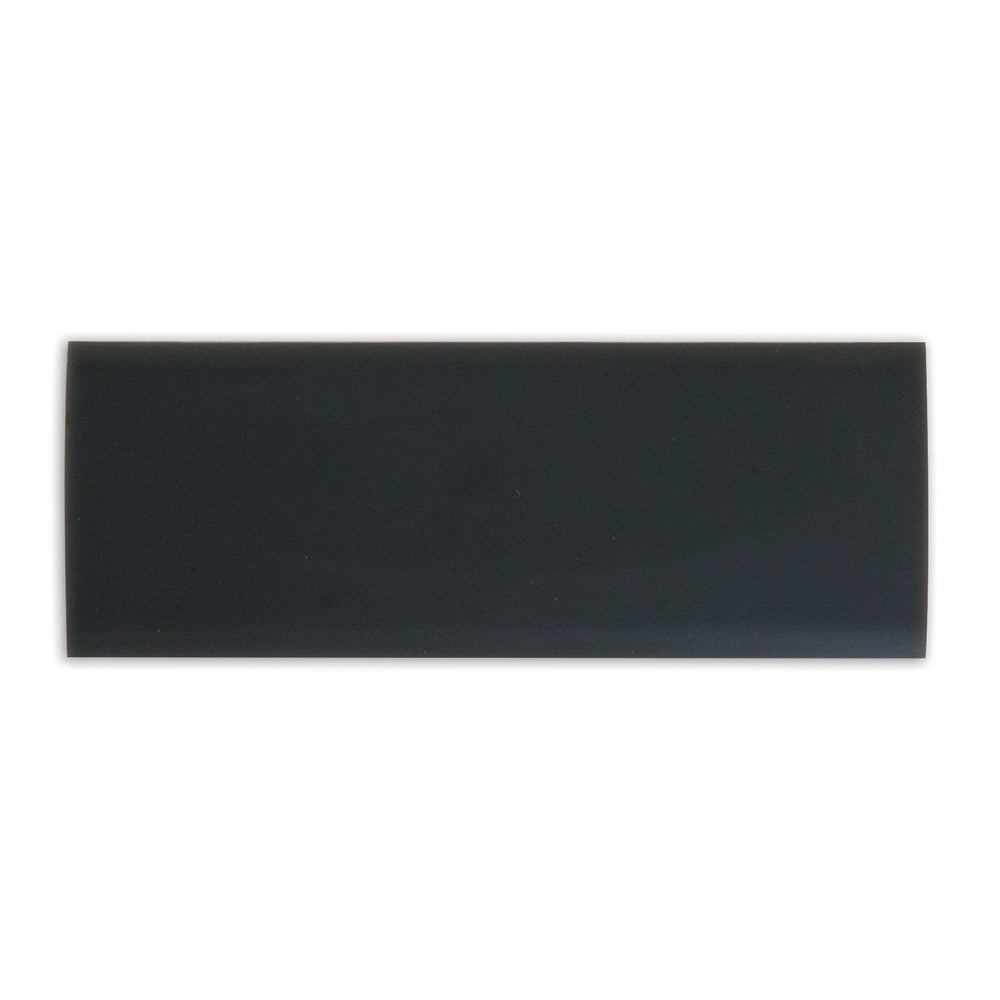 A glossy black rectangular ceramic tile is showcased on a plain white background, mirroring the sleek design of a Petmate Long Replacement Latch for Plastic Kennels.