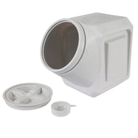 A square, white plastic Vittles Vault Outback Stackable Pet Food Storage Container is shown on its side with a wide opening. It features Gamma Seal Technology for an airtight seal. The lid and measuring scoop are placed separately next to it.