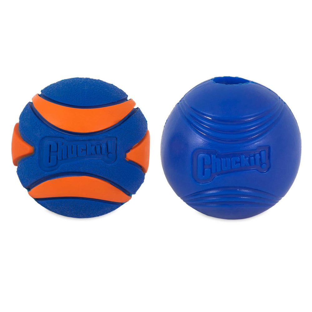 Two blue dog balls from the Chuckit! Sonic Fetch Pack. The left one, with orange curved stripes, is branded Chuckit and part of the fetch pack. The right ball is solid blue with embossed horizontal lines.