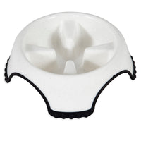 The JW Skid Stop Slow Feed Bowl from Jw is perfect for fast-eating dogs. It features a white bowl with raised dividers to pace meals, rugged black outer edges with textured grips, and a skid-stop base for stability.