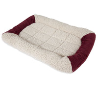 The Aspen Pet Self-Warming Bolster Mat by Aspen Pet features a plush, cream quilted surface with raised maroon sides and a self-warming bolster. Its Mylar interior provides warmth and comfort, making it perfect for small to medium-sized pets.