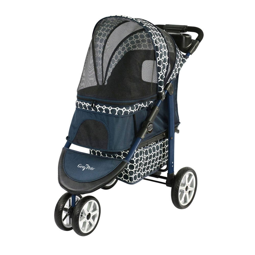 The Gen7Pets Monaco Dress Blue Pet Stroller from Gen7 boasts a stylish honeycomb pattern with a Smart-Zipper Canopy, four shock-absorbing Smart-Wheels, a mesh cover, padded handle, bottom storage compartment, and the Gen7Pets tag on the front footrest.