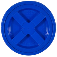 The Gamma2 GAMMA Seal Lid, shown in blue with a cross-shaped handle, is made from BPA-free HDPE plastic. It displays open and close instructions and fits buckets securely to create an airtight seal.