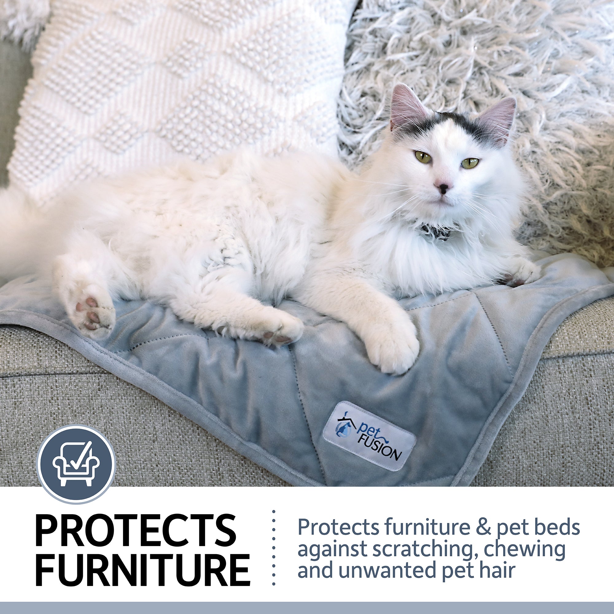 A fluffy white and gray cat lounges on a PetFusion Microplush Quilted Dog Blanket, an ultra-soft, machine-washable micro-plush in elegant gray that protects furniture and pet beds from scratching, chewing, and unwanted hair.