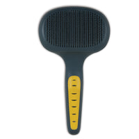 The JW Gripsoft Self-Cleaning Slicker Brush by Jw features a wide, rectangular bristle surface for shedding and an ergonomic dark handle with yellow accents for comfortable grooming.