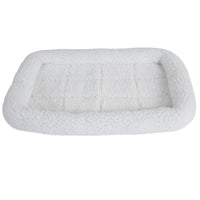 The SnooZZy Faux Sheepskin Bolster Kennel Mat by Snoozzy is a rectangular white fleece pet bed with a cushioned border, perfect for crate training. Its ideal for small pets, featuring a soft, textured surface and is machine washable for easy care.
