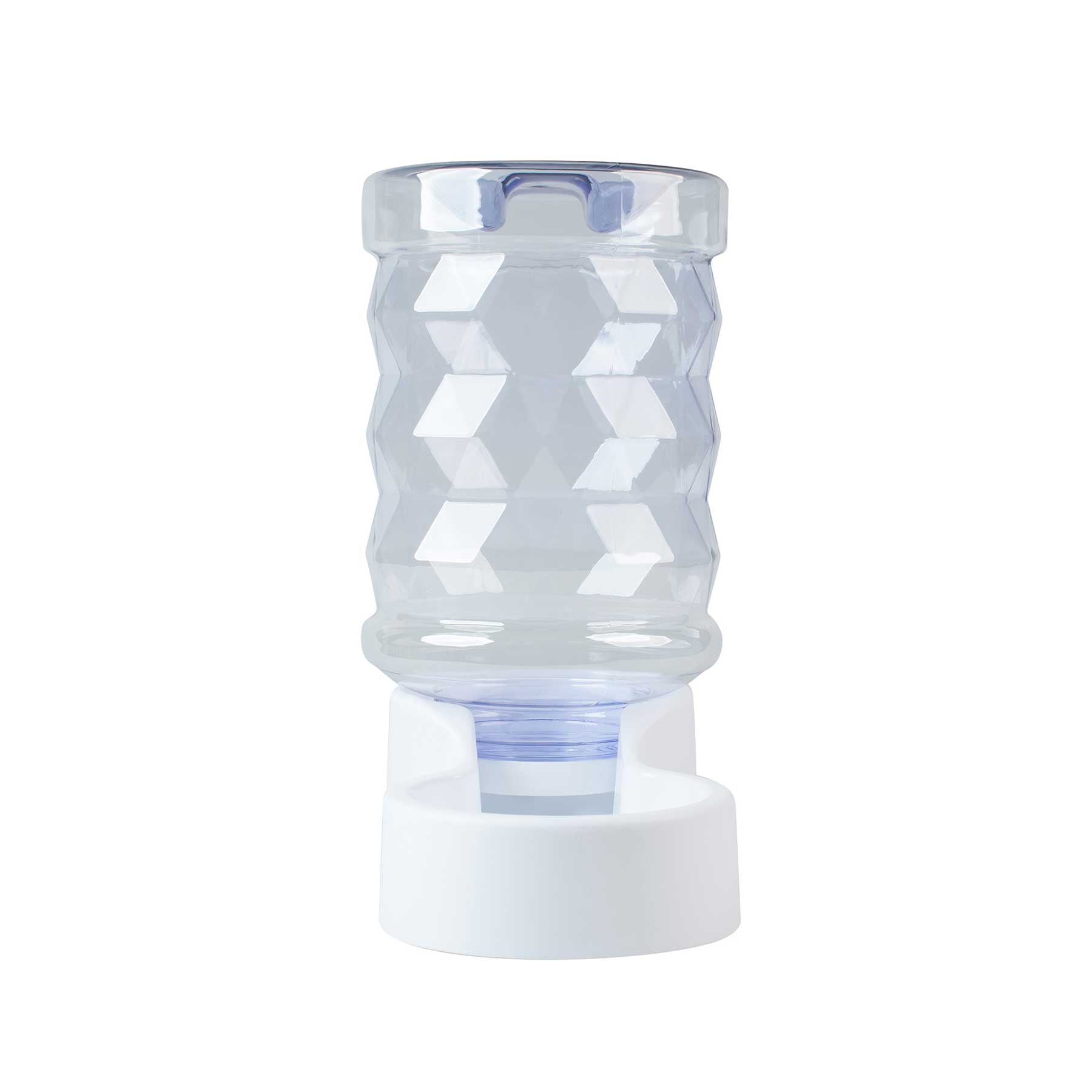The PetFusion H2O 2.5 Gallon Gravity Pet Water Dispenser by Pet Fusion features a transparent, faceted glass with a diamond-like pattern, elegantly positioned upside down on a circular white base. This stylish and functional design meets your pets hydration needs perfectly.