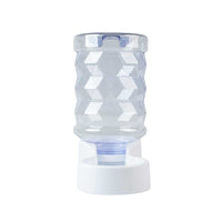 The PetFusion H2O 2.5 Gallon Gravity Pet Water Dispenser by Pet Fusion features a transparent, faceted glass with a diamond-like pattern, elegantly positioned upside down on a circular white base. This stylish and functional design meets your pets hydration needs perfectly.