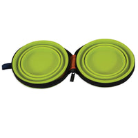 The Petmate Silicone Travel Bowl Duo by Petmate includes two green collapsible silicone bowls in an open black zippered case, ideal for travel. The nested bowls fit into grooves, while a small blue fabric loop accents the case.