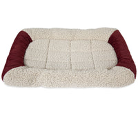 The Aspen Pet Self-Warming Bolster Mat from Aspen Pet is a rectangular pet bed with a cozy beige fleece surface and deep red plush edges. The inviting design, featuring a Mylar interior layer, ensures comfort for small to medium-sized pets.