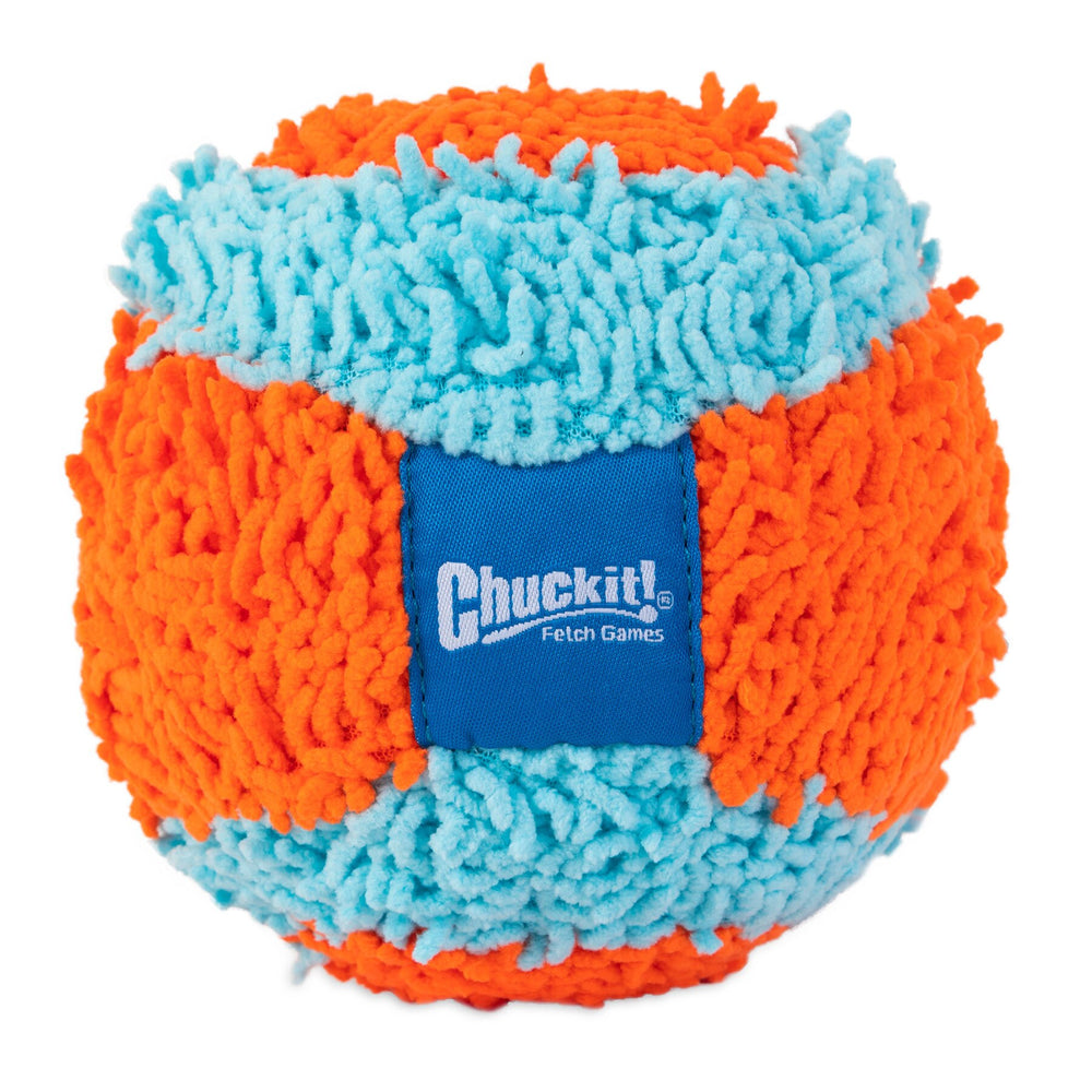The Chuckit! Indoor Ball is a round dog toy featuring shaggy textures in vibrant orange and blue. It includes a Bounceflex Core for optimal play and fits the Chuckit! Launcher. A blue label with Chuckit! Fetch Games adorns the side.