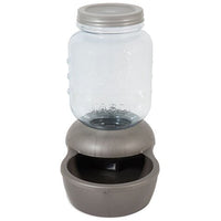 The Petmate 1-Gallon Mason Jar Gravity Pet Waterer has a BPA-free Mason-labeled clear glass jar and a gray plastic base with an integrated bowl for easy dispensing of fresh water.
