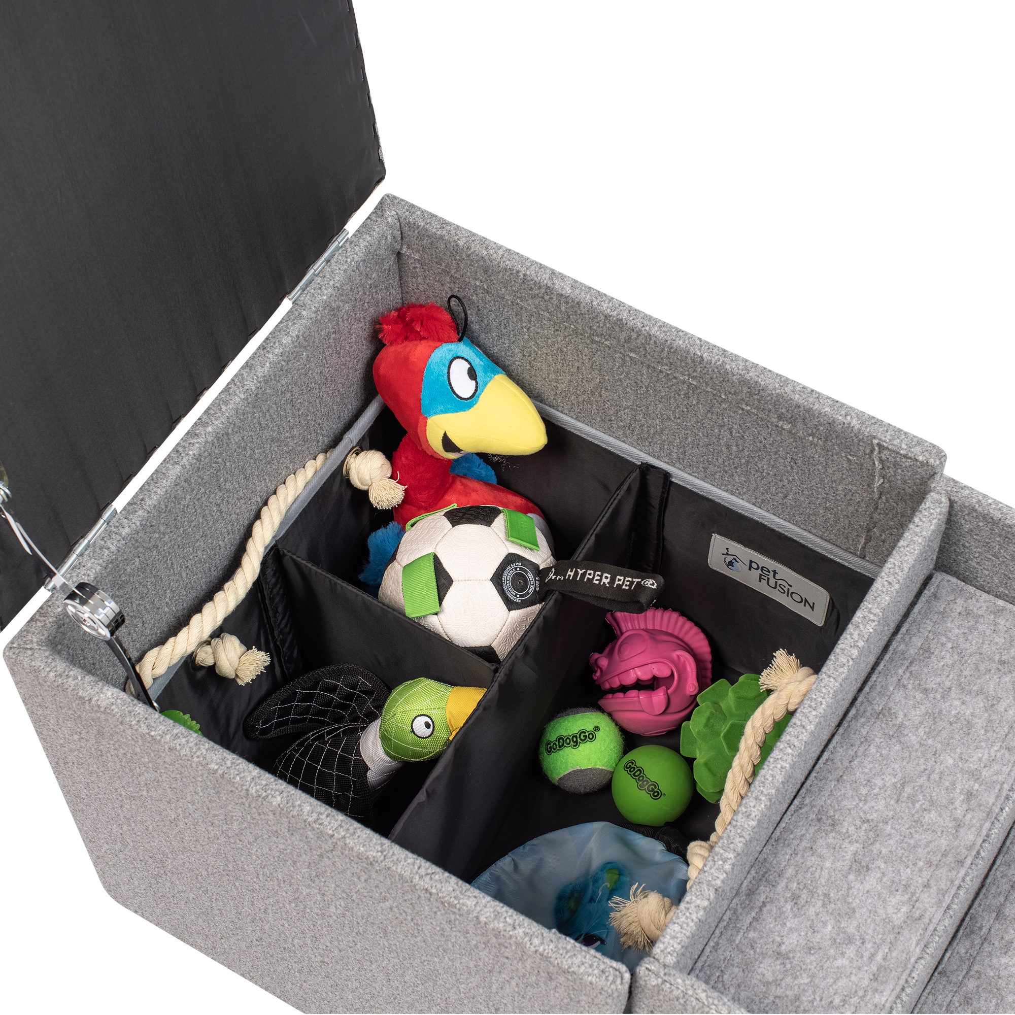 The PetFusion Multi-Purpose Pet Stairs, by Pet Fusion, serve as a premium gray storage ottoman filled with colorful pet toys like a plush parrot and soccer ball. Its thoughtfully sectioned interior offers an organized, multi-functional solution for play and tidy living.